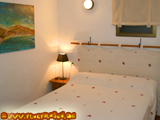 Doppelbett der Ferienwohnung Neptuno